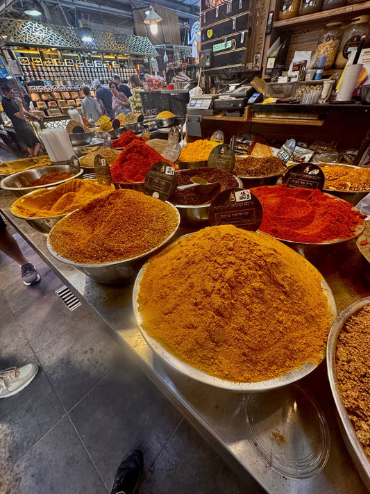bowls of fresh spices in a giant spice market in Israel